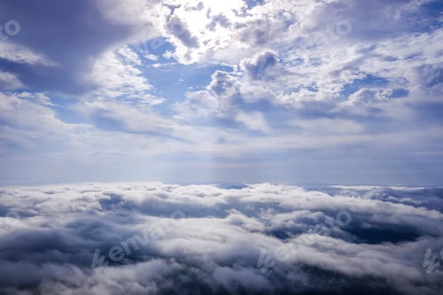 Preview: Scene of a winter cloudy sky from the top of a mountain peak.