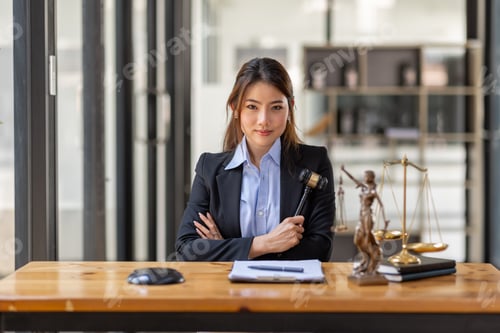 Preview: Business Asian woman in suit and Lawyer working on a documents at workplace office. Judge gavel