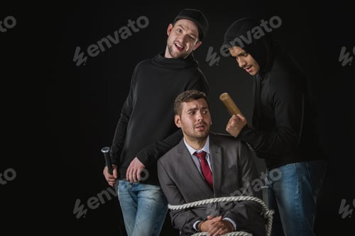 Preview: young businessman kidnapped by two robbers in black zoodies