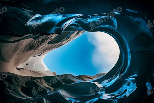 Preview: Stunning view from inside a blue ice cave in Iceland looking up to the sky