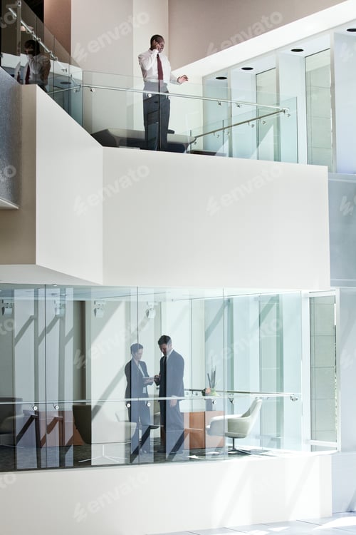 Preview: Business people on two floors of a large business center.