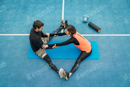 Preview: Stretching After Training, Young Woman with Fitness Coach, Outdoors