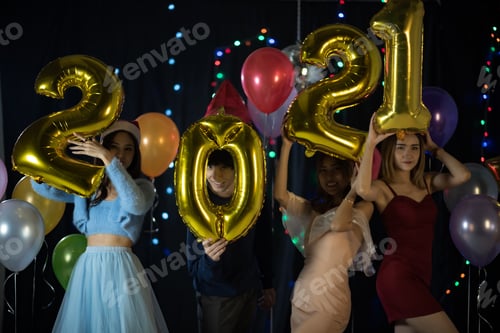 Preview: Happy Asian friends celebrating new year's eve 2021- people having fun together