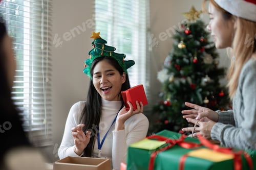 Preview: Festive Office Christmas Party with Colleagues Exchanging Gifts and Celebrating the Holiday Season