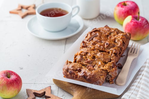 Preview: Apple bread on wooden board. Autumn fruit pie, gray background.