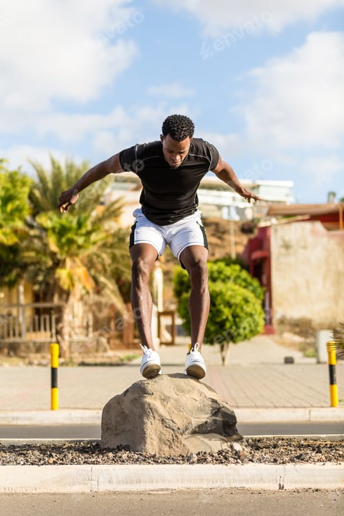 Preview: Black african american young man streching after outdoor jogging