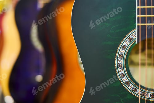 Preview: Row of classic acoustic guitars in the shop