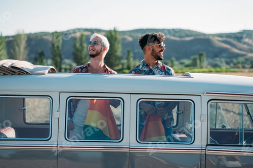 Preview: Gay couple in van holding LGBT flag