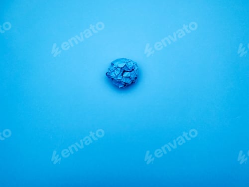 Preview: Successful idea concept, crumpled sheet of paper on blue background