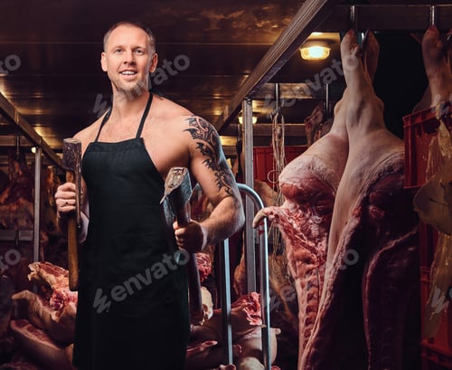 Preview: A butcher holds an ax in a meat factory.