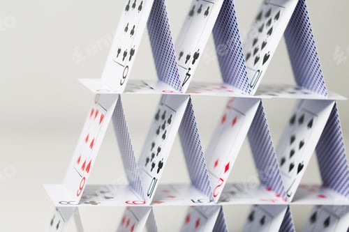 Preview: house of playing cards over white background