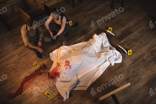 Preview: female and male detectives investigating dead body covered with white sheet at crime scene