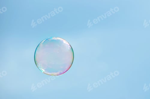 Preview: One soap sud bubble over blue sky