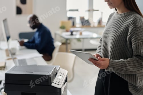 Preview: Unrecognizable Manager Using Digital Tablet And Printer