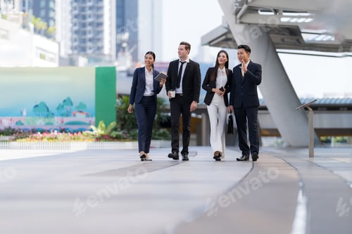 Preview: Business people walking and talk to each other in front of modern office