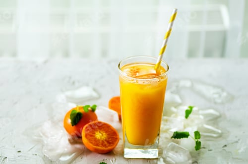 Preview: Orange juice with ice and tangerines on white background. Free space for your text. Copyspace. Cold
