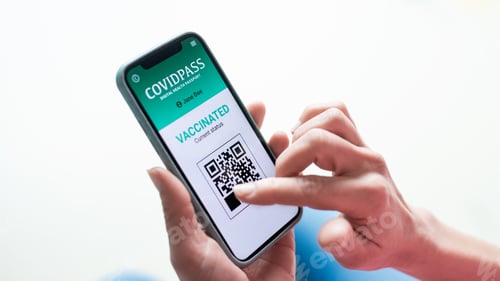 Preview: Close-up of female hands holding smartphone, coronavirus and vaccination concept
