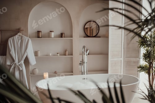 Preview: Luxury interior of big bathroom at modern african style with oval bathtub in natural lighting