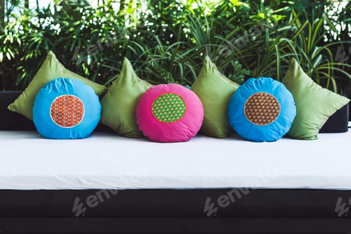 Preview: Multicolor round pillows on sofa