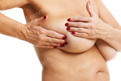 Preview: Adult Woman examining breast over white background
