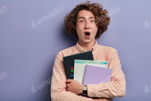 Preview: Person holding exercise books