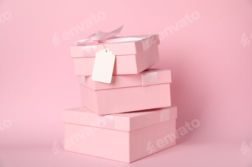 Preview: Gift boxes with blank tag on pink background