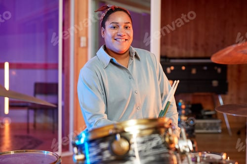 Preview: Woman Smiling at Drum Set