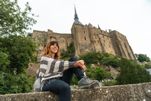 Preview: A young tourist visiting the famous Mont Saint-Michel Abbey, Normandy, France