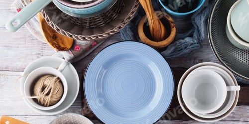 Preview: Ceramic and enamel crockery on wooden background