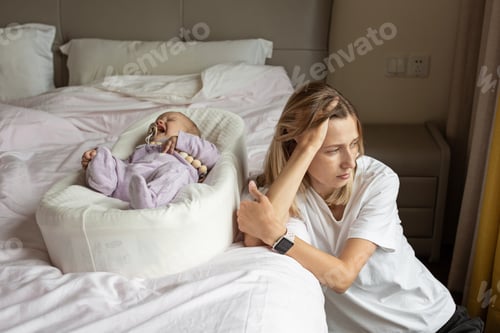 Preview: Tired Mother Suffering from experiencing postnatal depression. Health care mom motherhood stressful.