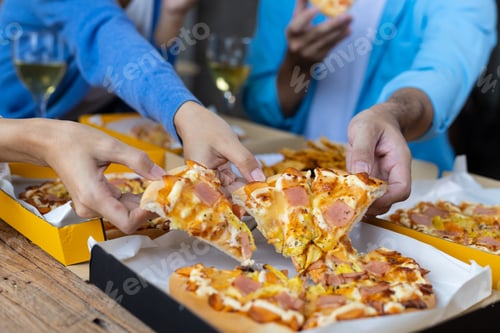 Preview: Colleague hands and friends eating pizza After a long meeting.