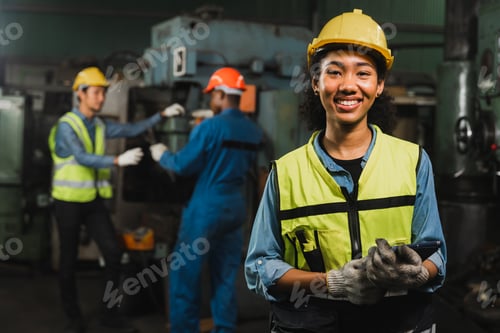 Preview: Engineer woman holding tablet and smile in factory industry working hard concept