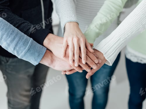 Preview: Young people stacking hands