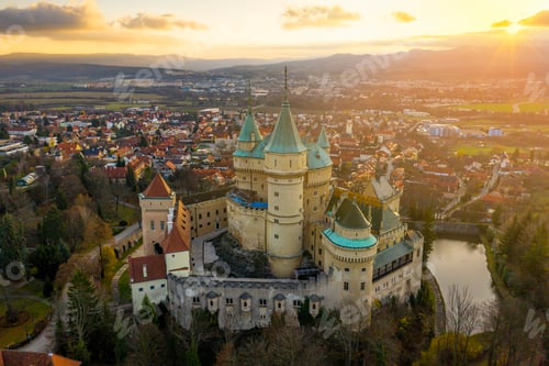 Preview: Bojnice castle and town in Slovakia from aerial view at sunrise