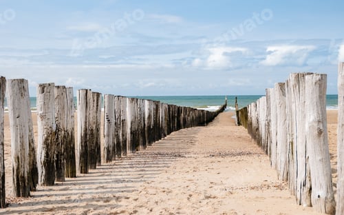 Preview: Beach poles on the beach of Domburg, Zeeland, the Netherlands during summer