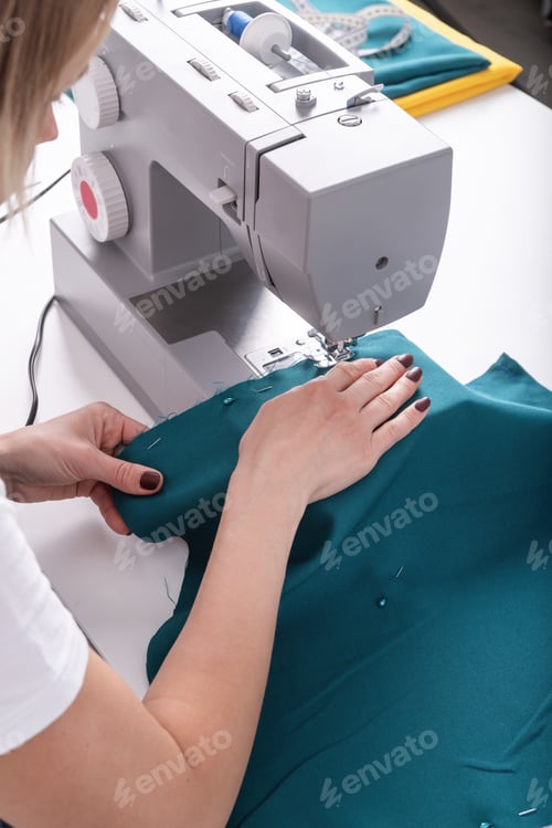 Preview: Woman tailor sawing