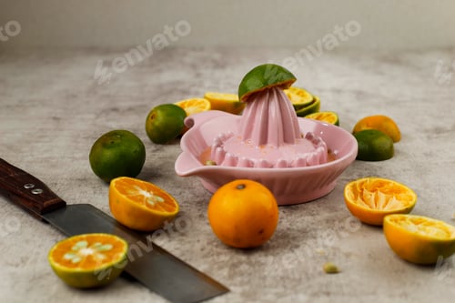 Preview: Squeezing Juice from Orange on a Manual Ceramic Squeezer.