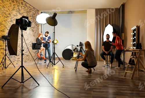 Preview: Photo studio with professional equipment and team of workers