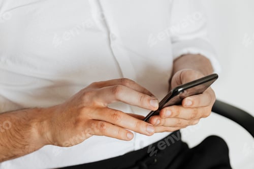 Preview: Businessman checking his social media account and messages on a phone