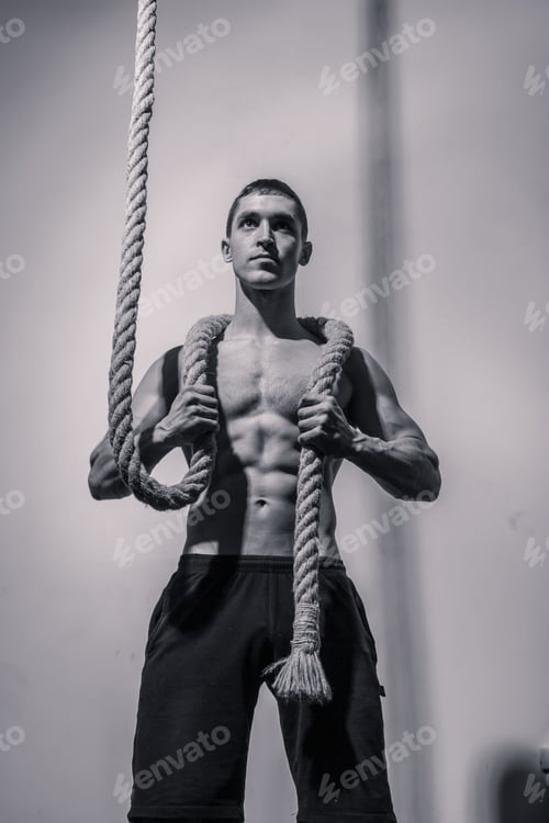 Preview: One Young Adult Man, Muscular Bodybuilder, Posing Holding Rope, Black And White Image.