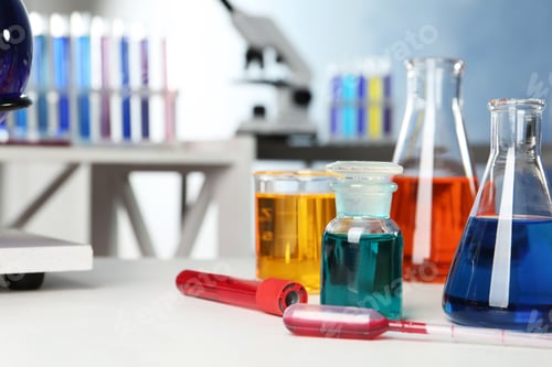 Preview: Different glassware with samples on table in chemistry laboratory