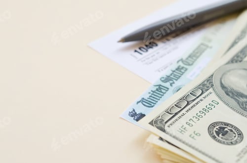 Preview: 1040 Individual Income tax return form with Refund Check and hundred dollar bills