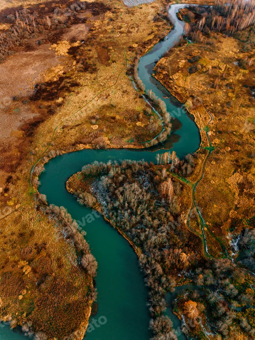 Preview: Aerial view of turquoise winding river and golden autumn