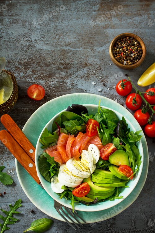 Preview: Healthy salad with Tomatoes, Salmon, Egg, Avocado and arugula.