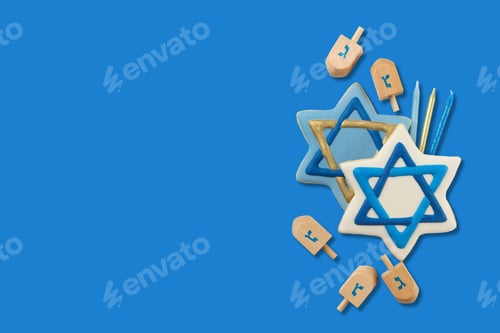 Preview: Hanukkah blue star-shaped cookies with dreidels and candles