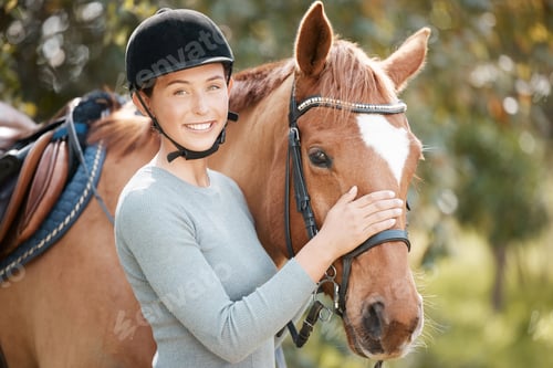Preview: Shot of an attractive young woman standing with her horse in a forest