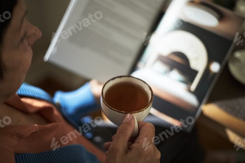 Preview: Enjoying Refreshing Cup While Reading in Cozy Indoors
