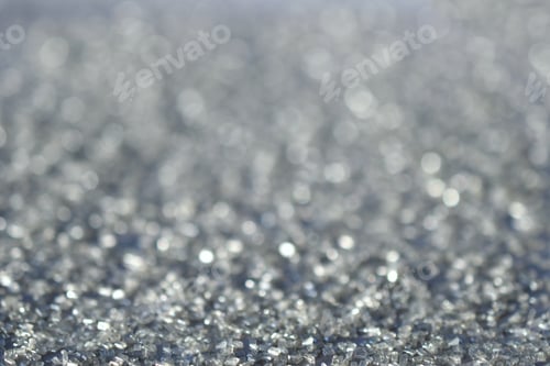 Preview: Abstract silver glitter bokeh sparkly shimmering background for the holiday or Christmas season.