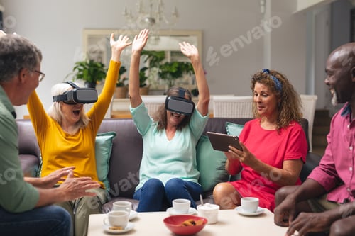 Preview: Multiracial senior woman and men with female friends using vr headsets at home