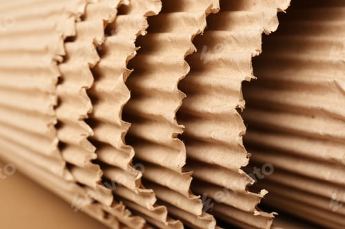 Preview: Roll of brown corrugated cardboard, closeup. Recyclable material